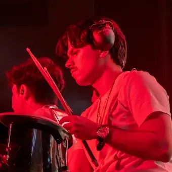 Estudiante de la compañia de musicos